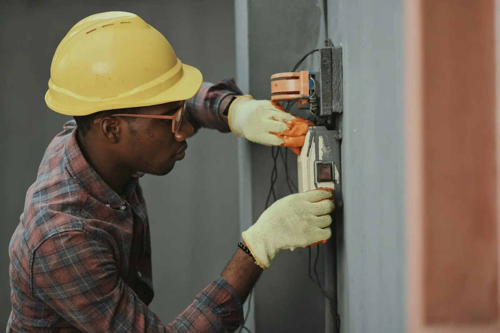 Technician checking pressures on an air conditioning system with gauges